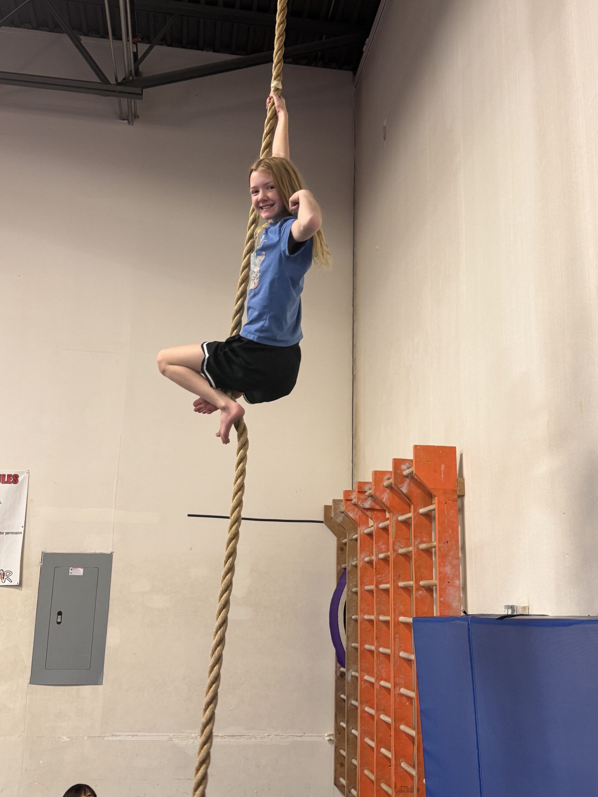 Girl climbing rope